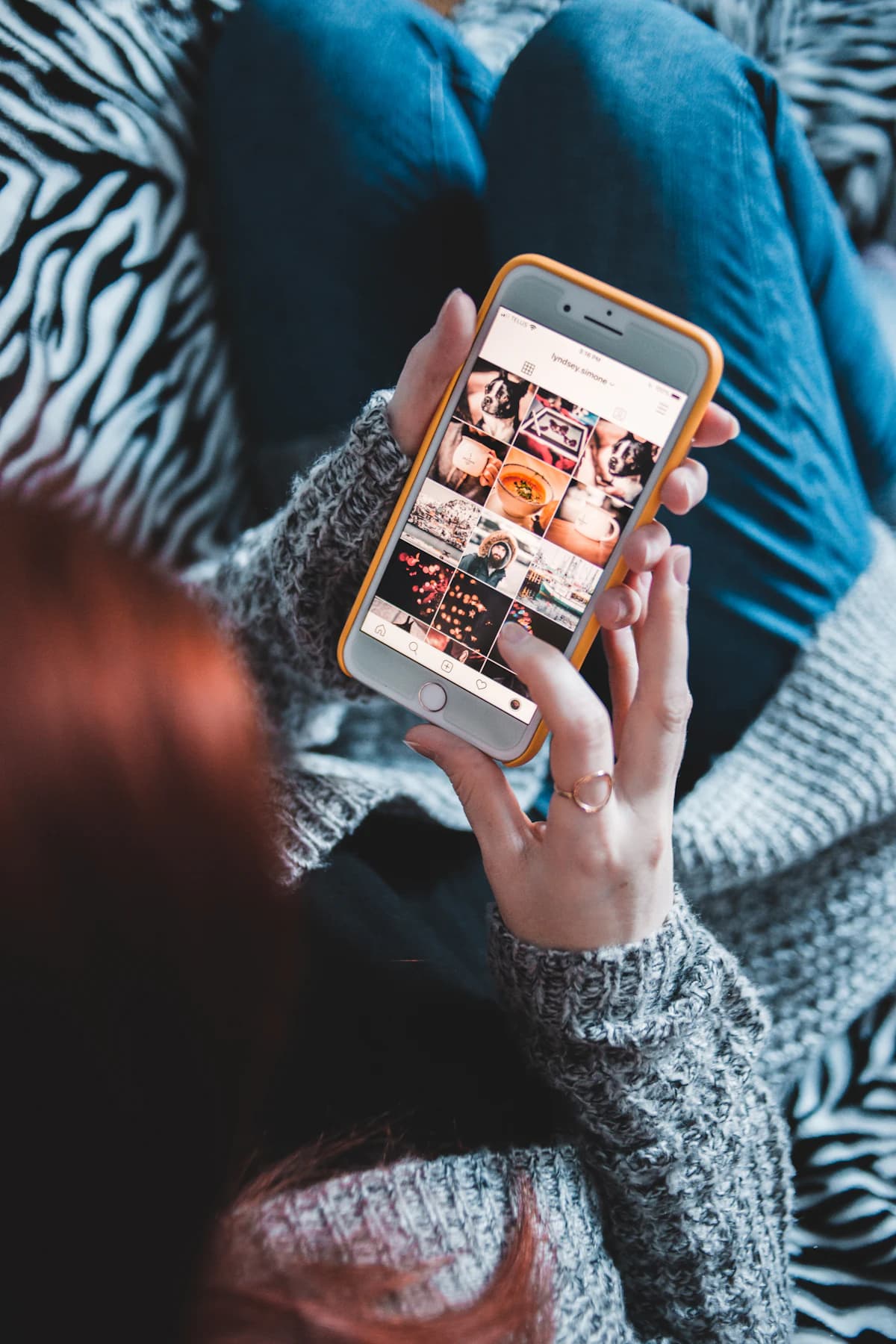 Person holding a phone while checking where an image appears online