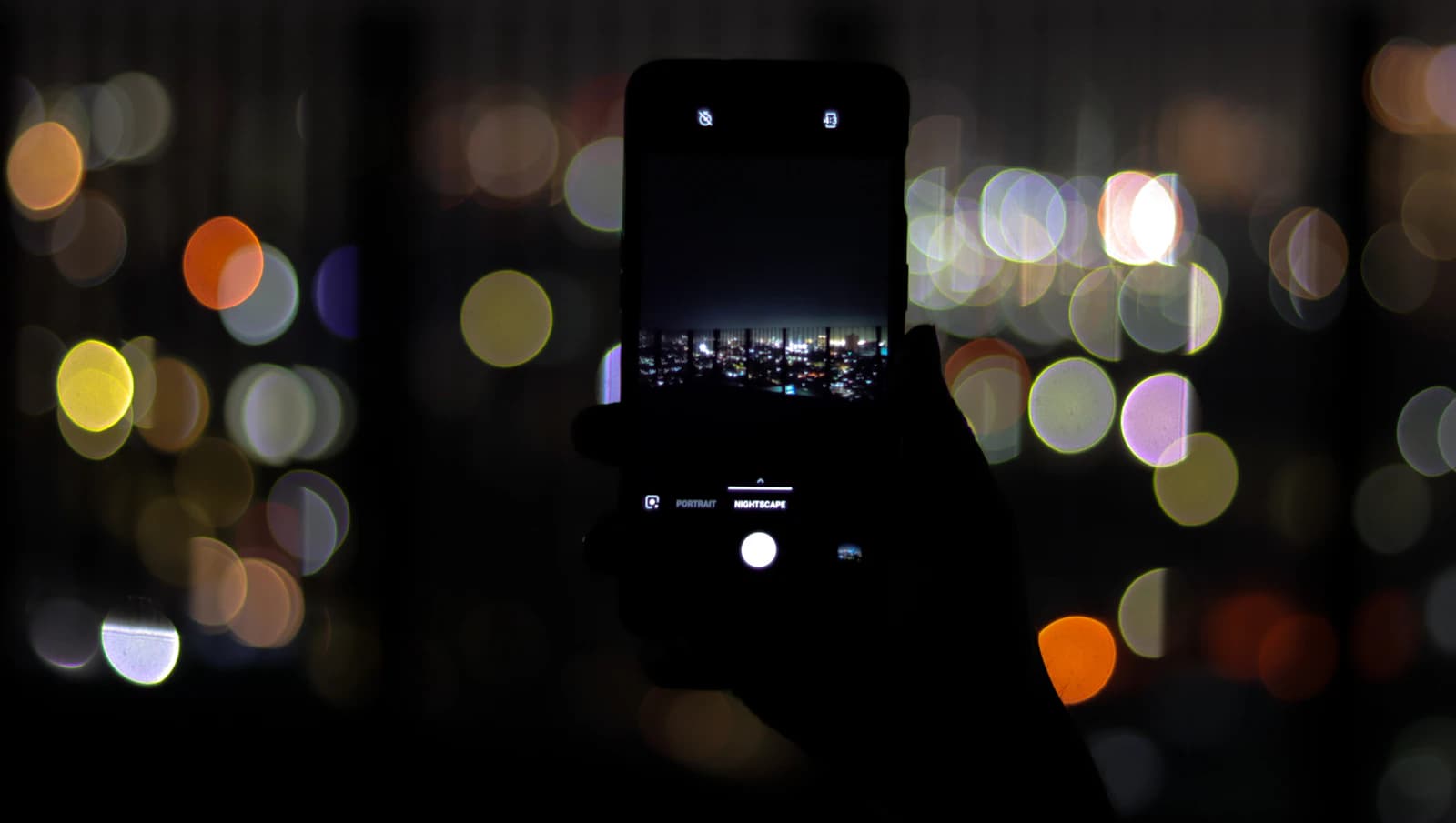 Smartphone at night illustrating a private Tea Dating Advice search